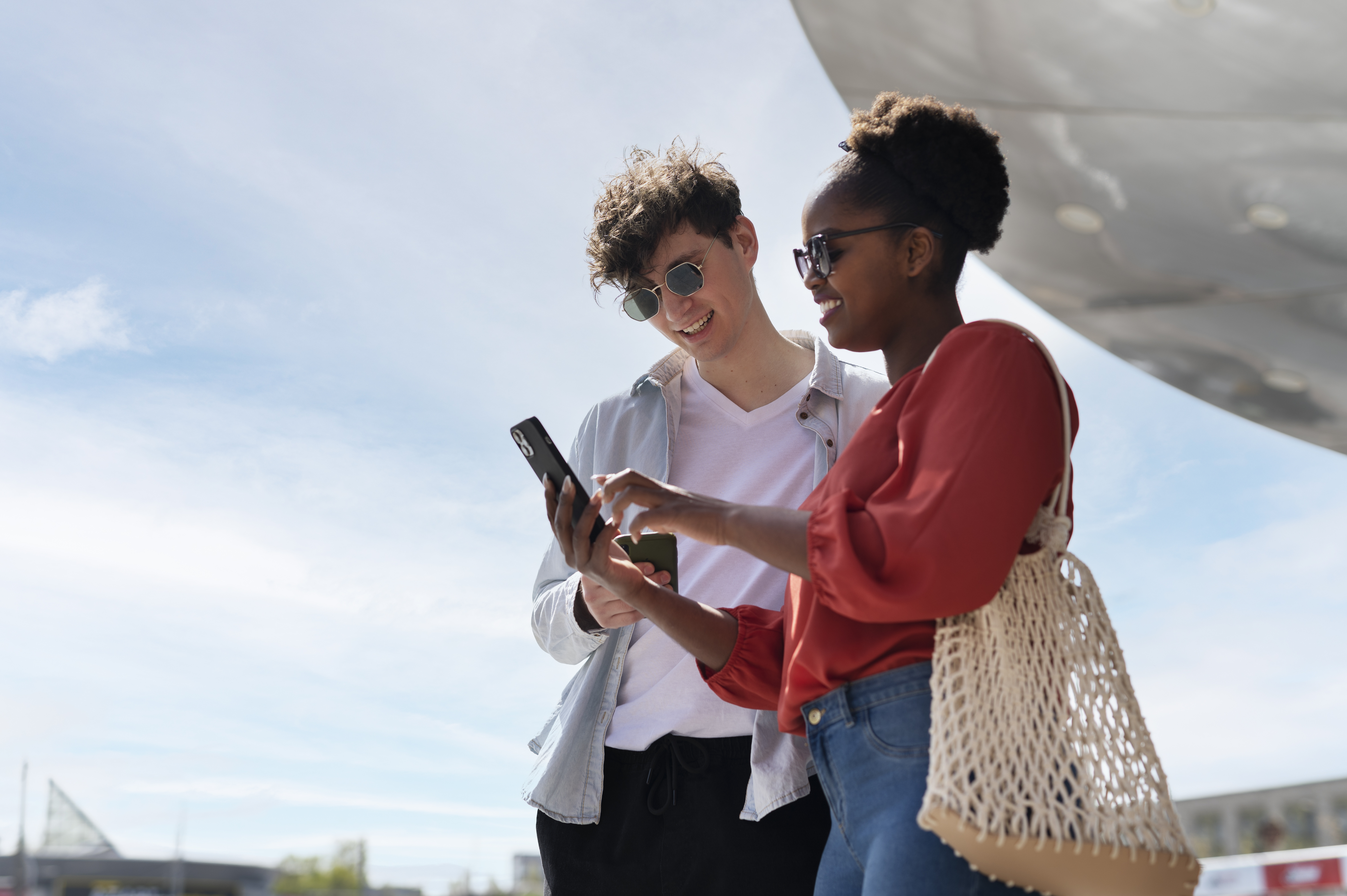 Couple using phones abroad